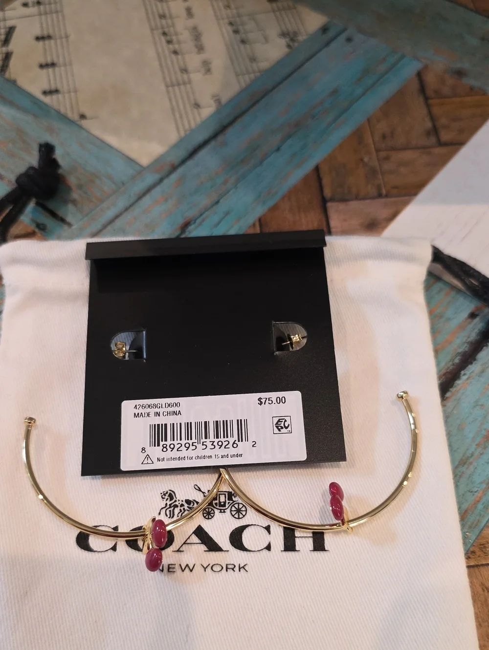 Coach gold tone